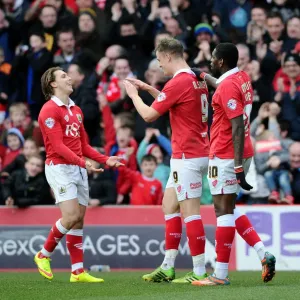Bristol City Celebrates Win Against Sheffield United: Matt Smith, Luke Freeman, and Jay Emmanuel-Thomas Rejoice on the Field