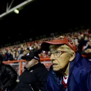 A Bristol City Fan Intently Watches the Action Unfold at Ashton Gate