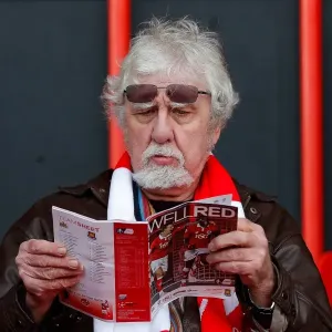 Bristol City Fan Peruses Match Program Before FA Cup Encounter vs. West Ham United Bristol City Fan Peruses Match Program Before FA Cup Encounter vs. West Ham United