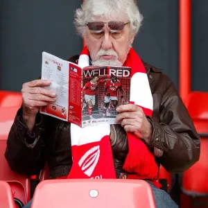 Bristol City Fan Perusing Match Program Before FA Cup Encounter vs. West Ham United, 2015 Bristol City Fan Perusing Match Program Before FA Cup Encounter vs. West Ham United, 2015