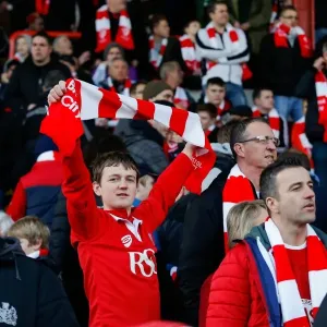 Bristol City Fan Waves Scarf at Ashton Gate Stadium During FA Cup Match vs. West Ham United Bristol City Fan Waves Scarf at Ashton Gate Stadium During FA Cup Match vs. West Ham United