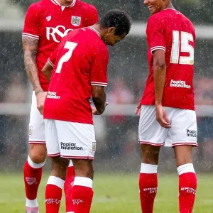 Bristol City Players Share a Moment of Joy in Pre-Season Match Print
