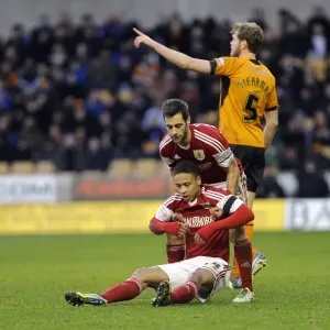 Bristol City: Sam Baldock Consoles Bobby Reid Amidst the Action at Molineux Stadium (Wolverhampton Wanderers vs. Bristol City, Sky Bet League One)