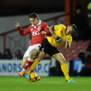Bristol City vs AFC Wimbledon: Luke Freeman Tackled by Barry Fuller in Johnstone's Paint Trophy Clash