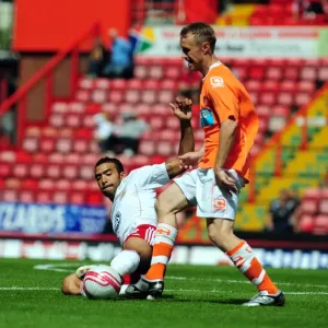 Bristol City vs Blackpool: Liam Fontaine's Intense Battle for Ball Possession - Championship Football Match, 2010