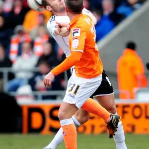 Bristol City vs Blackpool: Intense Aerial Battle Between Liam Kelly and Angel