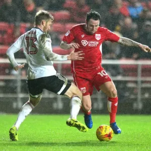 Bristol City vs Fulham: Intense Moment as Lee Tomlin Fights for the Ball against Tim Ream Bristol City vs Fulham: Intense Moment as Lee Tomlin Fights for the Ball against Tim Ream