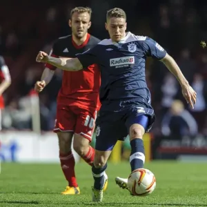Bristol City vs. Huddersfield: Intense Moment as Liam Kelly Challenges Calum Woods