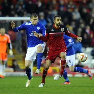 Bristol City vs Leicester City: Liam Fontaine vs Chris Wood Battle for Ball in Championship Match, January 2013