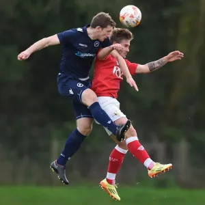 Bristol City vs Millwall: Intense Aerial Battle between Ben Withey and Keaton Wood