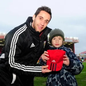 Bristol City Print: Young Fan Surprised with Cap