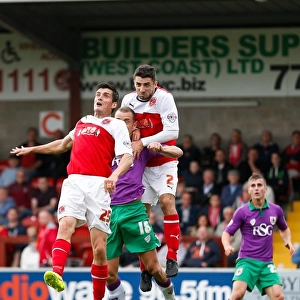 Bristol City's Aaron Wilbraham Battles for Ball Against Fleetwood's Jordan and McLaughlin
