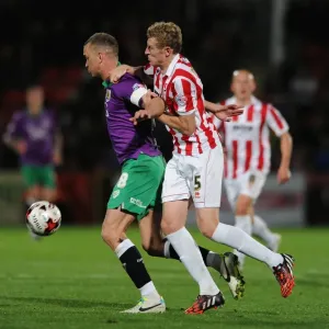 Bristol City's Aaron Wilbraham Secures Ball Against Cheltenham Town's Jack Deaman - Football Rivalry