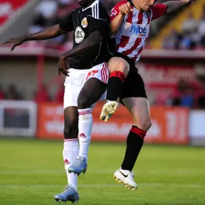 Bristol Citys Albert Adomah battles for the ball