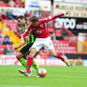 Bristol City's Brett Pitman vs Marcos Painter: Championship Battle at Ashton Gate, September 10, 2011
