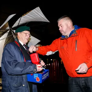 Bristol City's Buster Footman Collects Poppy Donations in Rain Print