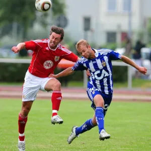 Bristol Citys Cole Skuse challenges for the ariel ball