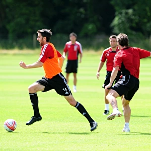 Bristol Citys Cole Skuse challenges for the ball with Bristol Citys Jamie McAllister