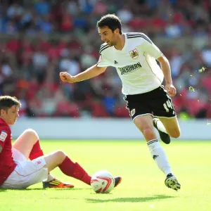 Bristol City's Cole Skuse Dashes Past Nottingham Forest's Greg Halford in Championship Clash