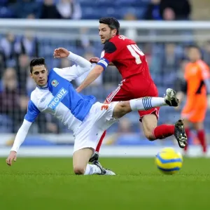 Bristol City's Cole Skuse Tackles Diogo Rosado in FA Cup Clash at Ewood Park