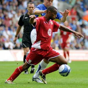 Bristol City`s Danny Haynes and Cardiff`s Gavin Rae battle for possession