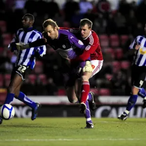 Bristol City's David Clarkson Battles Nicky Weaver: A Dramatic Moment from the FA Cup Match against Sheffield Wednesday (08/01/2011)