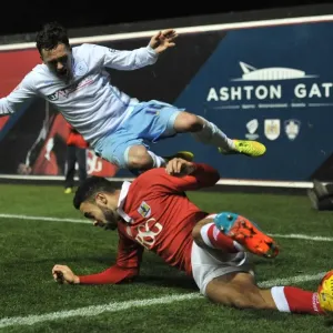 Bristol City's Derrick Williams Tackles Coventry City's Danny Swanson: A Moment from the Johnstones Paint Trophy Match at Ashton Gate Stadium