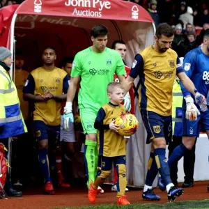 Bristol City's Gary O'Neil and Young Mascot Lead Team Out at The City Ground (Nottingham Forest vs. Bristol City, Sky Bet Championship) Bristol City's Gary O'Neil and Young Mascot Lead Team Out at The City Ground (Nottingham Forest vs. Bristol City, Sky Bet Championship)