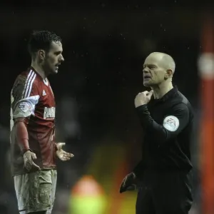 Bristol City's Greg Cunningham in Referee Discussion with Andy Woolmer during Bristol City vs Coventry City, Sky Bet League One match at Ashton Gate