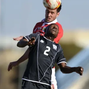 Bristol City's Greg Cunningham vs Extension Gunners Isaac Paete: A Heading Battle in Botswana, 2014 Bristol City's Greg Cunningham vs Extension Gunners Isaac Paete: A Heading Battle in Botswana, 2014