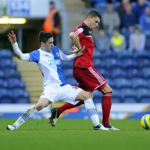 Bristol City's James Wilson Tackles Diogo Rosado in FA Cup Clash at Ewood Park