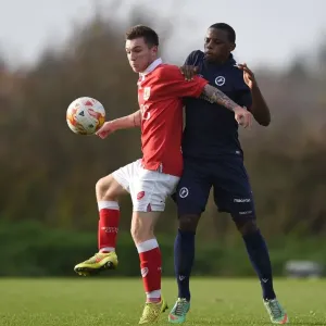 Bristol City's Jamie Horgan Fends Off Millwall's Josh Siafa in U21 PDL2 Clash