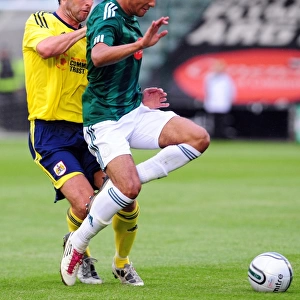 Bristol Citys Jamie McAllister battles for the ball