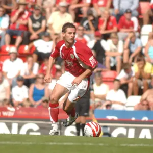 Bristol City's Jamie McAllister Stares Down QPR in Intense Football Showdown
