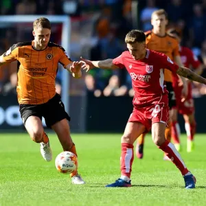 Bristol City's Jamie Paterson Dribbles Past Wolverhampton Wanderers David Edwards in Championship Clash