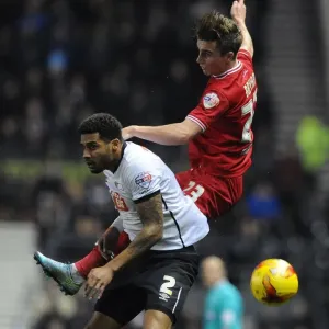 Bristol City's Joe Bryan Battles for a Header Against Derby County's Cyrus Christie Bristol City's Joe Bryan Battles for a Header Against Derby County's Cyrus Christie