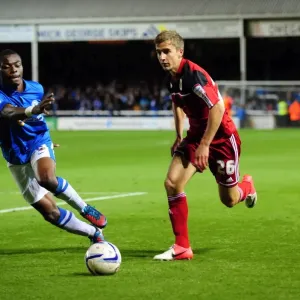 Bristol City's Joe Bryan Outmaneuvers Peterborough United's Gabriel Zakuani in Championship Clash Bristol City's Joe Bryan Outmaneuvers Peterborough United's Gabriel Zakuani in Championship Clash