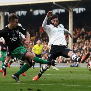 Bristol City's Joe Bryan Sends a Cross Past Fulham's Fernando Amorebieta in Championship Clash