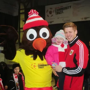 Bristol City's Jon Stead and Daughter Share a Moment with Scrumpy at Ashton Gate