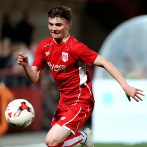 Bristol City's Jonny Smith Scores Past Cheltenham Town Defenders in Preseason Friendly