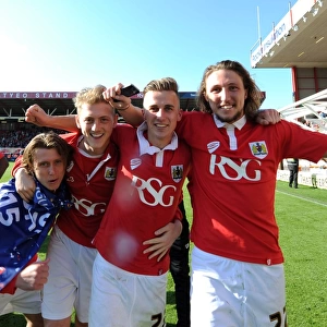 Bristol City's Jubilant Win: Luke Freeman, George Saville, Joe Bryan, and Luke Ayling Celebrate Promotion to Sky Bet League One