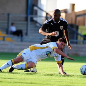 Bristol Citys Kalifa Cisse battles for the ball with Torquays Elliot Benyon Bristol Citys Kalifa Cisse battles for the ball with Torquays Elliot Benyon