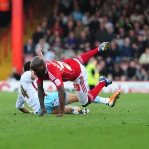 Bristol City's Kalifa Cisse Fouled by Tyrone Mears in Championship Match (2011) Bristol City's Kalifa Cisse Fouled by Tyrone Mears in Championship Match (2011)