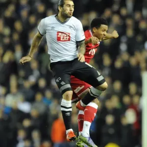 Bristol City's Korey Smith Battles for a Header Against Derby County's Bradley Johnson Bristol City's Korey Smith Battles for a Header Against Derby County's Bradley Johnson