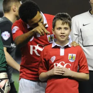 Bristol City's Korey Smith and the mascot celebrate a win in print Bristol City's Korey Smith and the mascot celebrate a win in print