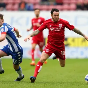 Bristol City's Lee Tomlin Clashes with Wigan Athletic's Callum Connolly during Sky Bet Championship Match