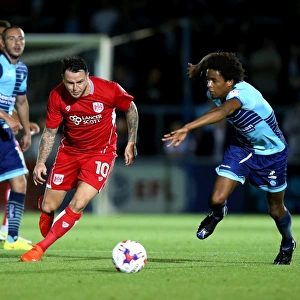 Bristol City's Lee Tomlin Dashes Past Wycombe Wanderers Sido Jombati in EFL League Cup Clash