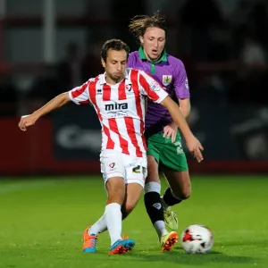 Bristol City's Luke Ayling Closes In on Cheltenham Town's Raffaele De Vita in Johnstone's Paint Trophy Clash