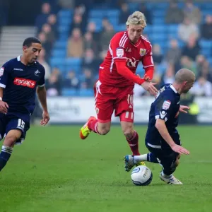Bristol City's Martyn Woolford Outmaneuvers Millwall Defense in 2011 Championship Match Bristol City's Martyn Woolford Outmaneuvers Millwall Defense in 2011 Championship Match