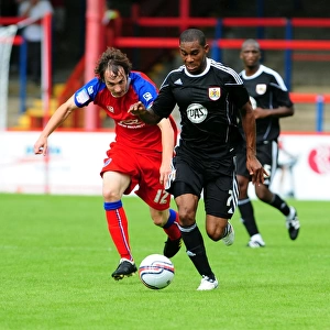Bristol Citys Marvin Elliott battles for the ball with Aldershots Danny Hylton